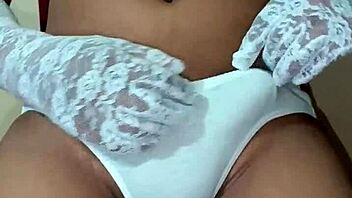 Ladyboy shemale wearing erotic white panty and bra.