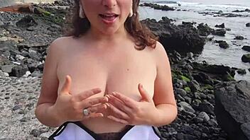 Young curvy milf flashes big tits and hairy pussy on public beach for dirty talk seduction