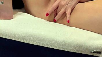 Blonde milf with big tits fingers her wet pussy in POV masturbation.