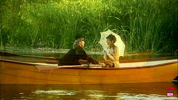 lovely couple hints at passionate outdoor banging on a small boat in the lake's embrace