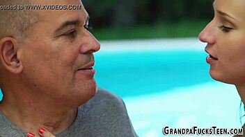 Brunette teen engages with grandfather in outdoor encounter