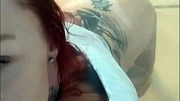 Redhead beauty teases on web with full sensuality in shower