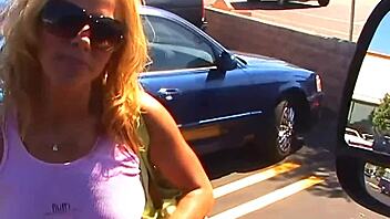 Blonde woman Kayla Synz engages in intimate bedroom activities with heels and lingerie.