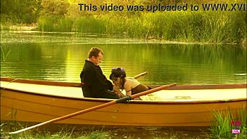 lovely couple hints at passionate outdoor banging on a small boat in the lake's embrace