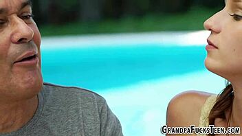 Brunette teen engages with grandfather in outdoor encounter