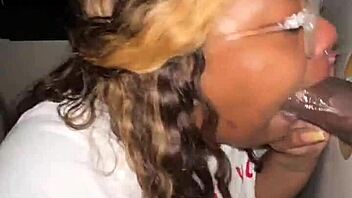 Ebony BBW throats strangers' BBC at the glory hole