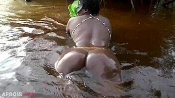 busty african witch grinds her thick body with big nipples in ritual dance and cleanses in sacred water outdoors