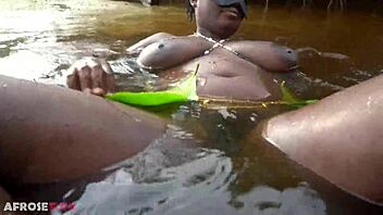 busty african witch grinds her thick body with big nipples in ritual dance and cleanses in sacred water outdoors