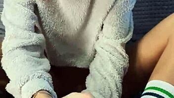 In the dorm room a cute petite girl next door bought special socks to playfully tease her roommate's interest