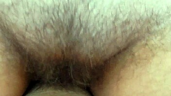 hairy mature riding with chubby ass and legs spread in sex session. details show beaver pussy and mature milf action.