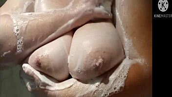 Betty Reddd enjoys a fun shower while pregnant, showcasing her big tits and bbw curves in a steamy solo session.