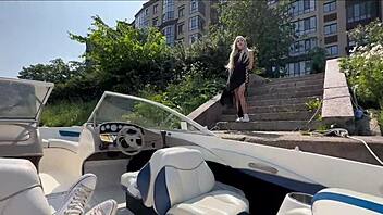 attractive blonde in lingerie enjoys time with captain on boat