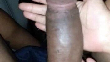 Petite Asian beauty teases massive black cock with slick oiled hands in steamy session