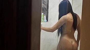I secretly watch my attractive roommate as she undresses, uses the bathroom, and showers in private moments.