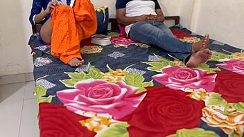 Indian woman and young guy share hotel bed in clear conversation during their encounter.