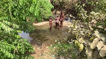 curvy brown skinned ebony flashes at the stream ready to be devoured outdoors