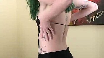 Young Tattooed Amateur In Cute Black Bodysuit And Gothic Miniskirt Poses Tall And Sexy With Tight Fishnets And Natural Tits During Photoshoot