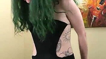 Young Tattooed Amateur In Cute Black Bodysuit And Gothic Miniskirt Poses Tall And Sexy With Tight Fishnets And Natural Tits During Photoshoot