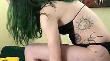 Young Tattooed Amateur In Cute Black Bodysuit And Gothic Miniskirt Poses Tall And Sexy With Tight Fishnets And Natural Tits During Photoshoot