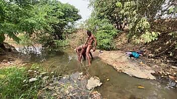 curvy brown skinned ebony flashes at the stream ready to be devoured outdoors