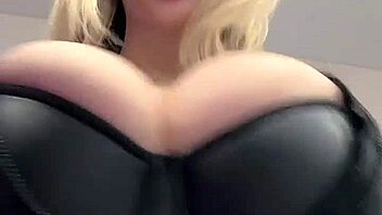 Big natural tits strain against the tight elastic leather material in a juicy display