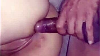 Amateur footage shows a curvy Latina engaging in intimate backdoor play on camera.