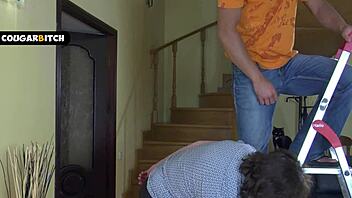 Horny mature woman enticed the repairman into a passionate encounter on the couch.