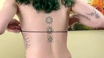 Young Tattooed Amateur In Cute Black Bodysuit And Gothic Miniskirt Poses Tall And Sexy With Tight Fishnets And Natural Tits During Photoshoot