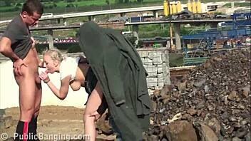 Cute Little 18+ Chick Takes Monster Cocks in Public Construction Site Orgy With Two Guys