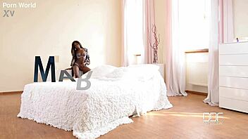 Intriguing black beauty with long hair shoves pink toy deep into shaved pussy during solo masturbation session