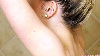 gorgeous blonde enjoys a relaxing shower in the bathroom