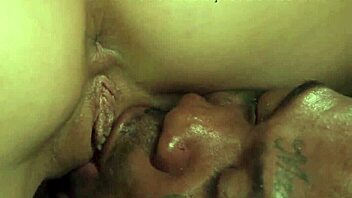 the big tits blonde kneels down and deepthroats the black cock in interracial oral action