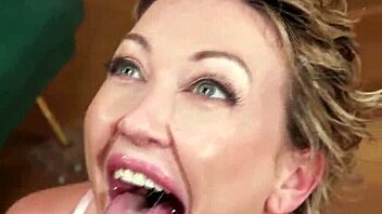 the big tits blonde kneels down and deepthroats the black cock in interracial oral action