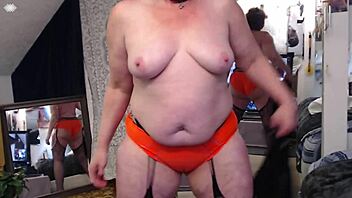 Retro mature Dawnskye1962 teases with big tits and ass in morning lingerie and wet t-shirt mirror play.