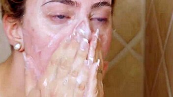 gorgeous blonde enjoys a relaxing shower in the bathroom