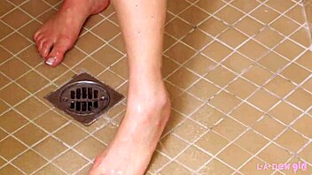 gorgeous blonde enjoys a relaxing shower in the bathroom