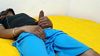 In a quiet moment, a young man indulges in solo self-pleasure.