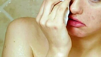 gorgeous blonde enjoys a relaxing shower in the bathroom