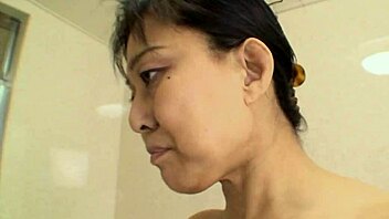 Horny Japanese milf in stockings and heels rides a big cock, getting deepthroat and anal fingering until a facial cumshot.