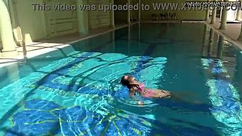 Hey, check out Jessica Lincoln looking amazing in her pink bikini while splashing around in the pool with friends