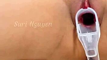 vietnamese girl explores her wet hairy pussy with toys in bedroom closeup.