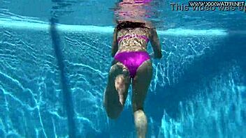 Hey, check out Jessica Lincoln looking amazing in her pink bikini while splashing around in the pool with friends