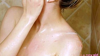 gorgeous blonde enjoys a relaxing shower in the bathroom
