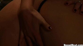 why is this submissive lesbian slave bent over and getting spanked by her dominant madame?