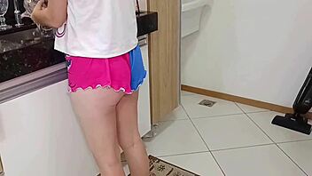 Young woman in kitchen at dawn eager for intimate encounter