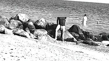 voyeur spots huge cock on nude beach, like whoa it's massive and nudist vibes everywhere, ya know?