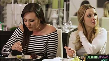 squirting lesbian gets fingered under the table by glamorous big tits girlfriend