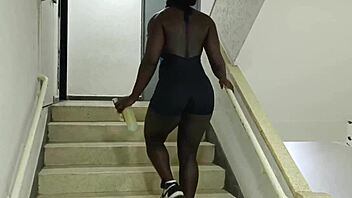 Personal trainer shows neighbor free squat lesson