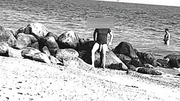 voyeur spots huge cock on nude beach, like whoa it's massive and nudist vibes everywhere, ya know?