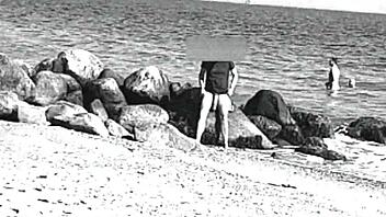 voyeur spots huge cock on nude beach, like whoa it's massive and nudist vibes everywhere, ya know?